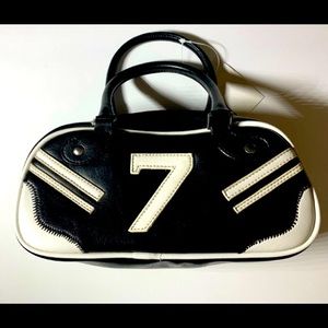 Vegan leather lucky number seven handbag 
New with tags.